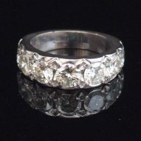 Lot 269 - 18ct gold and diamond seven stone ring.