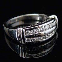 Lot 283 - Platinum and diamond half hoop eternity ring with