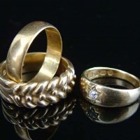 Lot 296 - Gypsy diamond ring and two gold rings.
