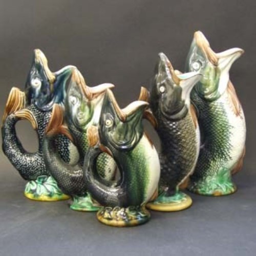 Lot 584 Five majolica fish jugs,