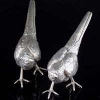 Lot 140 - Silver pair of pheasants.