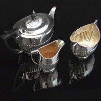 Lot 151 - Silver three - piece tea set