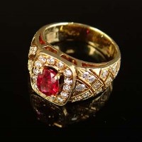 Lot 173 - Ruby and diamond yellow gold ring