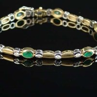 Lot 221 - 18ct gold emerald and diamond bracelet