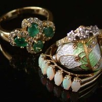 Lot 222 - Three gold dress rings and a reproduction Faberge