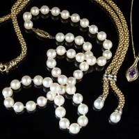 Lot 223 - Cultured pearl necklace, and two gold necklaces