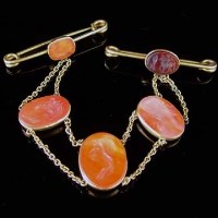 Lot 263 - Yellow metal chain set with five red hardstone seals