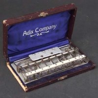 Lot 297 - Adix Company adding machine.