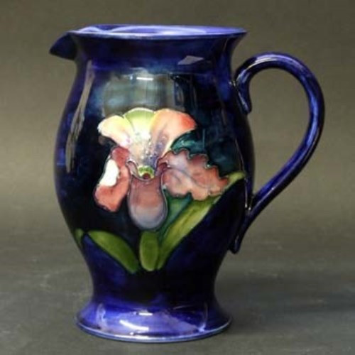 Lot 411 - Moorcroft orchid jug.