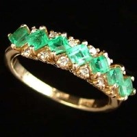 Lot 297 - 18ct gold emerald and diamond ring