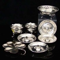 Lot 251 - Four suits dishes, silver clover dish and three small bowls