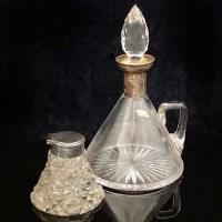 Lot 258 - Conical shaped glass decanter with silver rim and