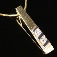 Lot 295 - 14k gold and diamond pendant necklace