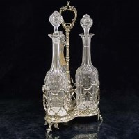 Lot 280 - Victorian electro-plated decanter stand and three