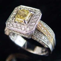 Lot 311 - Natural intense fancy yellow diamond ring