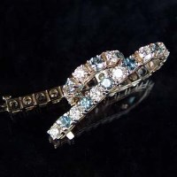 Lot 324 - Aquamarine and diamond line bracelet