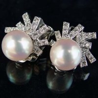 Lot 326 - Pair 14k white gold diamond and pearl earclips
