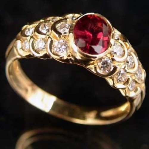 Lot 327 - Ruby and diamond yellow gold ring