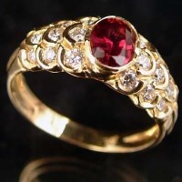Lot 327 - Ruby and diamond yellow gold ring