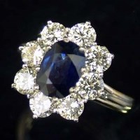 Lot 383 - 18ct diamond and sapphire cluster ring