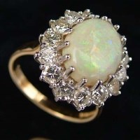 Lot 387 - Opal and diamond ring