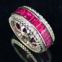 Lot 391 - Ruby and diamond eternity ring