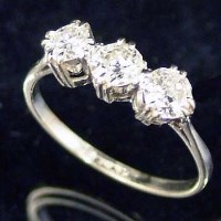 Lot 405 - Platinum set three stone diamond ring