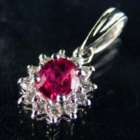 Lot 409 - Ruby and diamond platinum pendant