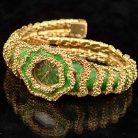 Lot 437 - Green enamel and gold wrist watch