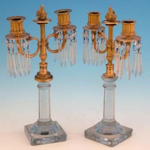 Lot 439 - Pair of brass and glass candelabra.