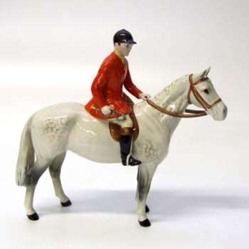 Lot 606 - Beswick huntsman on grey horse.