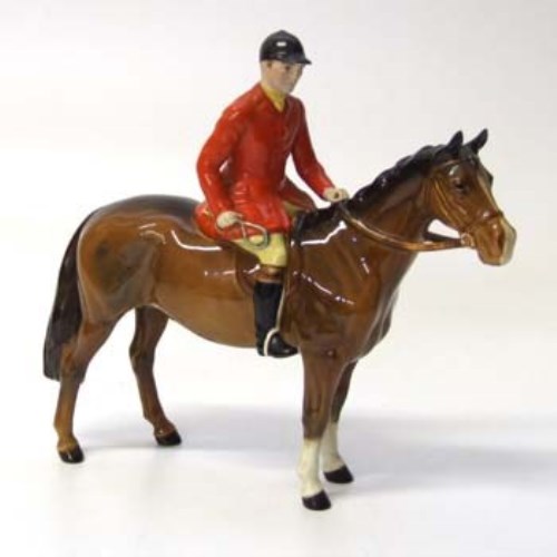 Lot 608 - Beswick huntsman on brown horse.