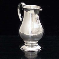 Lot 373 - George II silver jug