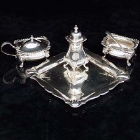 Lot 381 - Square silver waiter and a three-piece condiment