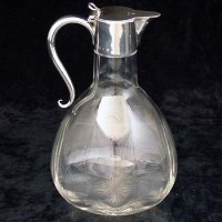 Lot 384 - Silver lidded claret jug