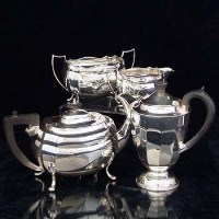 Lot 396 - Three-piece silver tea set and a non-matching hot