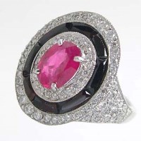 Lot 413 - Ruby and diamond oval ring