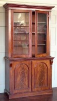 Lot 893 - Victorian Mahogany bookcase on cupboard.