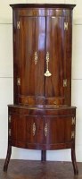 Lot 898 - Mahogany corner cupboard on a base.