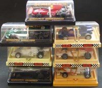 Lot 142 - Seven Scalextric car in plastic display cases