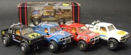 Lot 358 - Five Scalextric Datsun 4x4 trucks