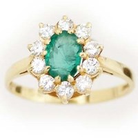 Lot 439 - 18ct emerald and diamond cluster ring