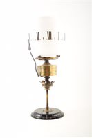 Lot 357 - A Victorian 'clock' oil lamp.