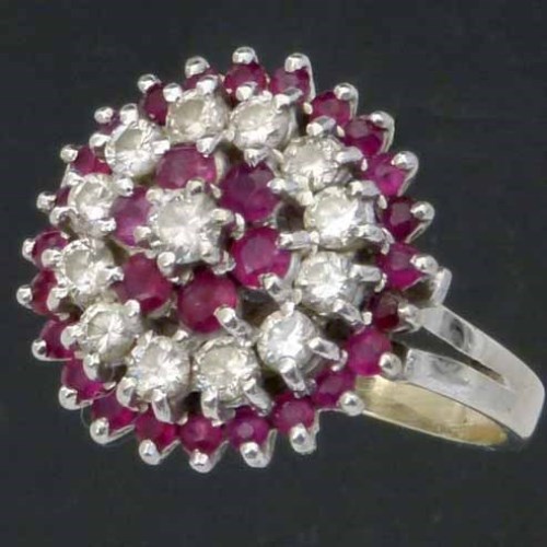 Lot 330 - Ruby and diamond circular cluster ring
