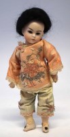 Lot 23 - Oriental bisque head German doll, mould number