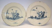 Lot 110 - Pair of Delft plates, painted with a boy chasing