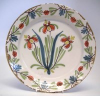 Lot 123 - Delft charger, boldly painted with three flowers