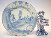 Lot 132 - Delft monkey and a plate.