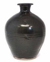 Lot 256 - Jim Malone (1946-) vase, incised with a wavy lines and decorated with a tenmoku glaze, impressed monogram to side of fo