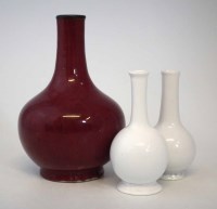 Lot 327 - Chinese ox blood vase, also two white glass vases